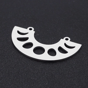 Detail of silver moon phase charm with dual hanging loops in stainless steel