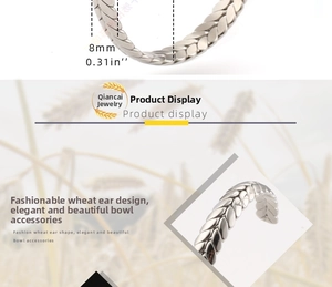 Detail showing the 8mm silver wheat ear textured stainless steel open bangle bracelet