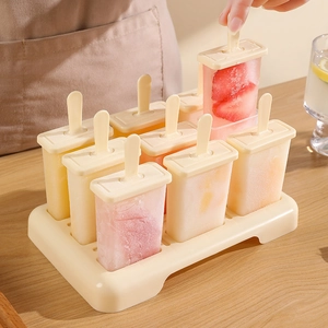 DIY beige plastic popsicle mold set with eight compartments for homemade fruit ice pops