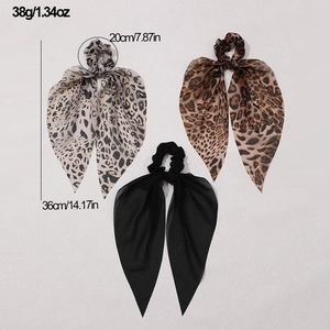 Detail view of leopard print hair scrunchies showing size 36cm length and 20cm diameter