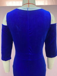 Detail of dark blue velvet evening dress showing the off-shoulder back and silver trim