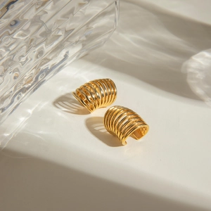 Minimalist 18k gold plated stainless steel multi-layer spring ear cuffs on a white surface