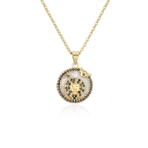 Golden Leo zodiac necklace featuring a lion relief and black zircon accents