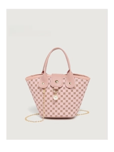 Close-up of pink bucket bag with vintage floral pattern and large pearl pendant detail