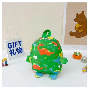 Detail view of a green kids dinosaur backpack with colorful patterns and 3D limbs decor
