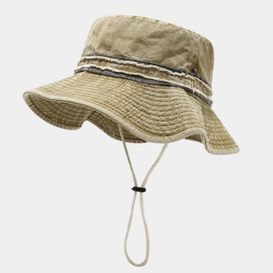 Close-up of retro washed bucket hat with frayed edge detail and adjustable windproof cord