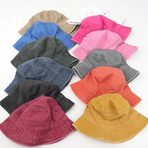Washed cotton bucket hats in various colors with metal eyelets and wide brim sun protection