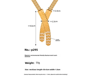 Detail view of gold 18K plated titanium necklace with cross pendant and crystal pavé