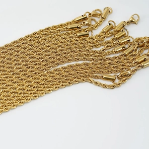 Detailed shot of multiple gold-plated stainless steel rope chains with lobster clasps