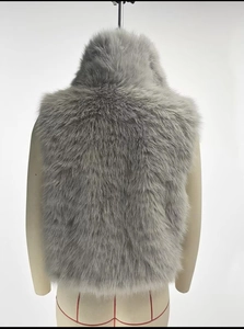 Back view of a thick grey faux fur vest showing plush texture on a mannequin