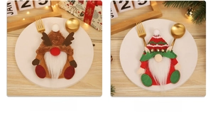 Detailed view of Christmas gnome and reindeer themed cutlery holders on wooden table