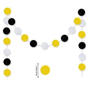 Detailed view of graduation paper garland featuring black, yellow, and white 5cm circles