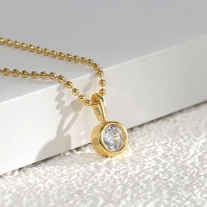 Minimalist gold ball chain necklace with a single round-cut zircon pendant for women