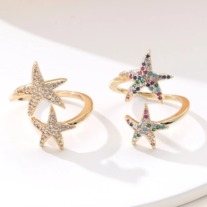 Close-up of hip-hop starfish rings with gold plating and colorful zircon stones
