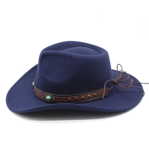 Detail of dark blue cowboy hat featuring a leather band with turquoise decorative studs
