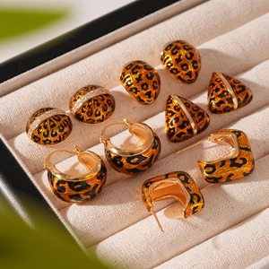 Vintage leopard print gold earrings set with geometric shapes and crystal accents