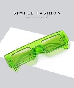 Detail of neon green square sunglasses temple showing CE mark and size specs N3629