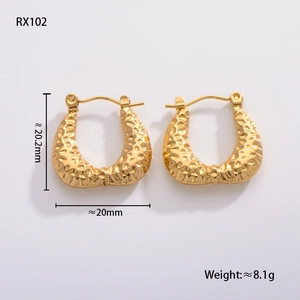 Macro shot of gold geometric leaf earrings showing texture and 20mm dimensions