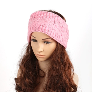 Close-up of pink cable knit texture and thick winter lining on a thermal headband