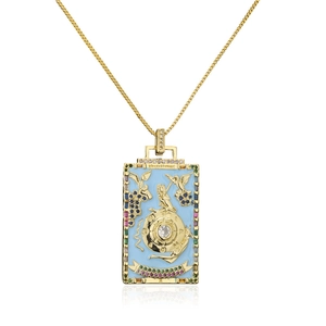 Macro view of Wheel of Fortune tarot pendant with blue enamel and colorful zircons
