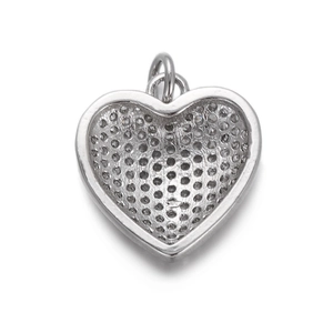 Detail view showing the honeycomb texture on the back of the heart wing charm