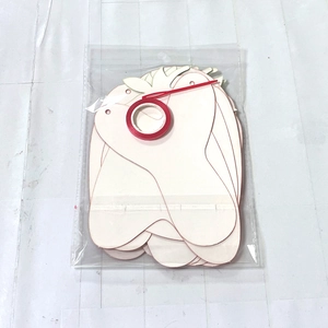 DIY strawberry wooden cutouts with red hanging ropes for birthday party decorations