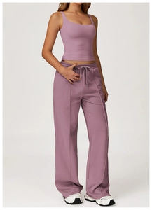 Detail view of lilac high-waist wide-leg sweatpants and matching U-neck sports tank top