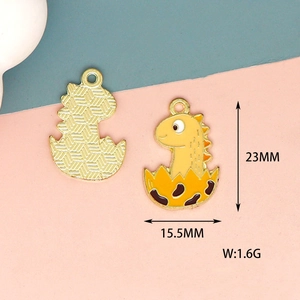 Detailed view of yellow dinosaur enamel charm with exact 23mm x 15.5mm measurements