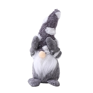 Gray and white Christmas faceless gnome plush with snowflake pattern hat on white background