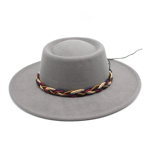 Detailed view of grey wool jazz hat featuring colorful rainbow braided rope band detail