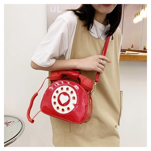 Unique red patent leather crossbody bag in a creative vintage telephone shape design