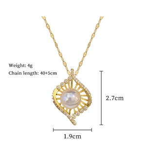 Detail shot of pearl and rhinestone pendant showing dimensions 2.7x1.9cm and 4g weight