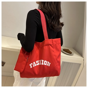 Large red canvas tote bag with FASHION letter print and matching small zipper pouch