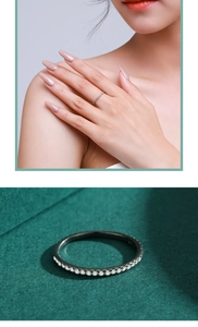 Detailed view of a slim S925 sterling silver band with sparkling full diamond inlay