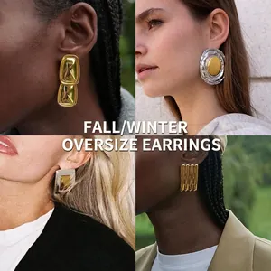Detailed close-up of oversized vintage metal stud earrings set with textured gold finish