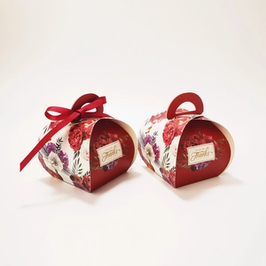 Detail of red floral candy box with handle and Special Thanks gift tag
