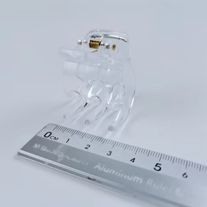 Macro shot of a 3.5cm transparent square hair claw clip with scale measurement