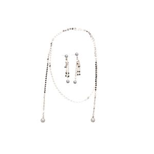 Elegant silver jewelry set with crystal beads and spherical pendants on white background