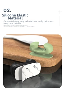 Macro shot of flexible silicone organizer hooks with strong adhesive backing for kitchen tools