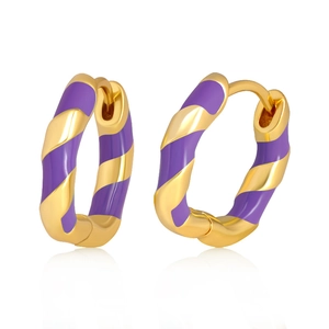 Detailed macro view of gold-plated twisted earrings with vibrant purple enamel patterns
