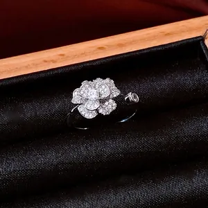 Elegant silver zirconia flower open ring with micro-pave petals in a black velvet box