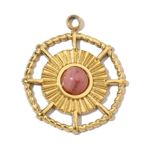 Macro detail of gold stainless steel sunburst pendant with pink natural stone inlay