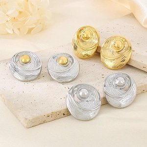 Detailed view of 18k gold plated stainless steel earrings with irregular wavy texture