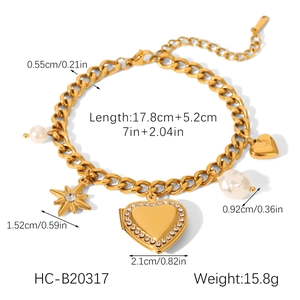 Detail of Cuban link bracelet with diamond heart locket, star charm and pearls