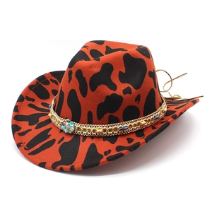 Orange cowboy hat with black cow print and beaded ethnic chain strap for women