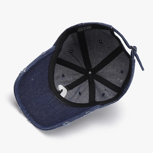 Deep blue washed cotton baseball cap with vintage distressed brim and letter embroidery