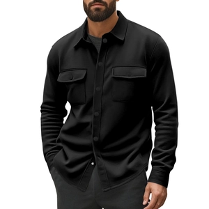 Detail of black fleece-lined work jacket featuring dual chest pockets and snap buttons