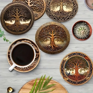Set of 5 circular wooden coasters with Tree of Life carved patterns on light wood table