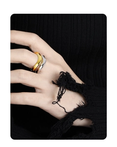 Detail of irregular wave design S925 sterling silver rings worn on fingers