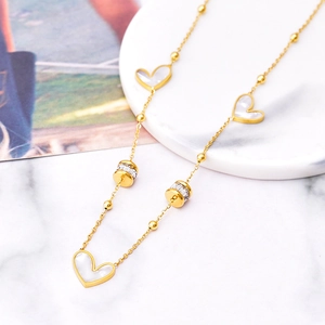 Gold-plated stainless steel heart necklace with white shell charms and zircon cylinders